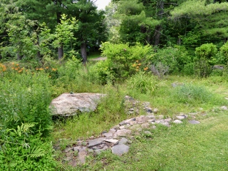 The boulder is situated at the southwest corner of the property.