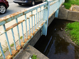 Eyelevel view of the disk on the bridge wingwall.