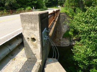 Eyelevel view of the disk on the bridge wingwall.