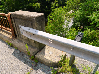 Eyelevel view of the disk on the NW wingwall of the bridge.