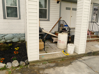 Eyelevel view of the disk on the corner of the porch.