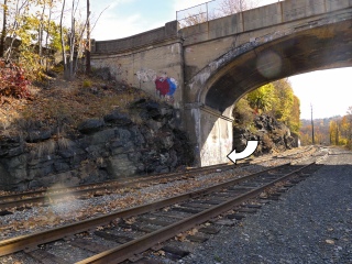 Looking SE toward the abutment; position of the mark is indicated.