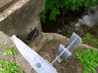 Eyelevel view of the disk on the bridge wingwall.