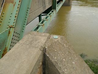 Eyelevel view of the disk on the bridge wingwall.