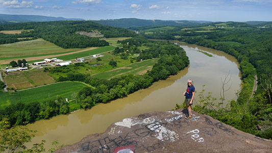 The rocks are high above an impressive horseshoe bend in the river.