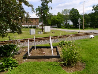 Looking NE toward the railroad crossing at Church Street and an unidentified old building