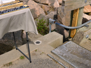 Eyelevel view of the disk in the corner of the concrete pier.