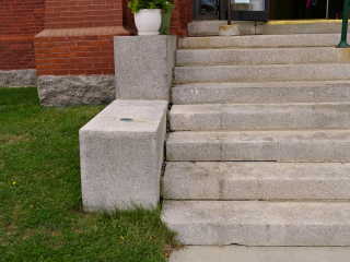 Eyelevel view of the disk on the granite steps.