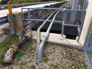 Eyelevel view of the disk on the spillway wall.