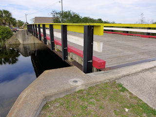 Eyelevel view of the disk on the abutment of the bridge to the Miccasukee village.