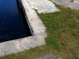 Eyelevel view of the disk on the corner of the seawall