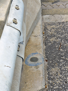 Eyelevel view of the disk on the bridge abutment.