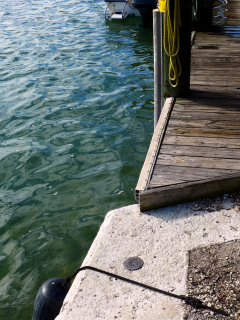 Eyelevel view of the disk on the corner of the seawall