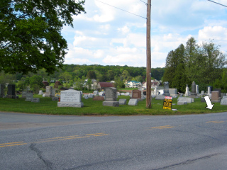 Looking NE toward the mark and sign, Drums Community Cemetery