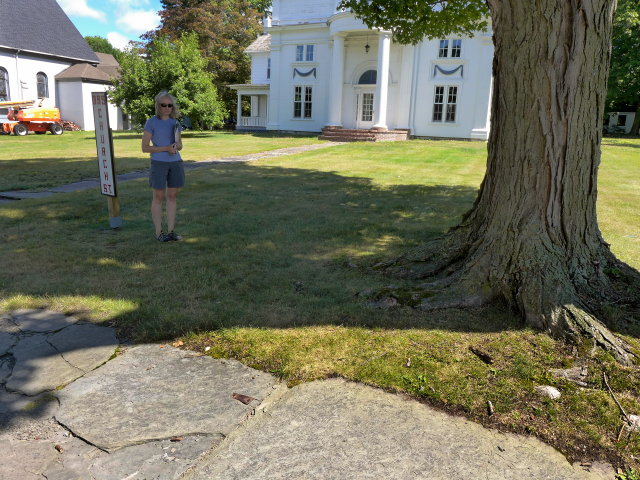 Zhanna stands near the hinge in the sidewalk, one of our favorite clues from this year's hunt.