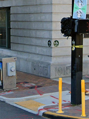 View of the corner with benchmark visible, from Google Street View, February 2021