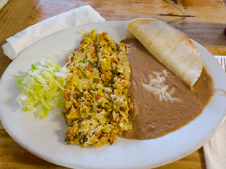 Scrambled eggs with chiles, tomatoes and onions at Cora's Cafe