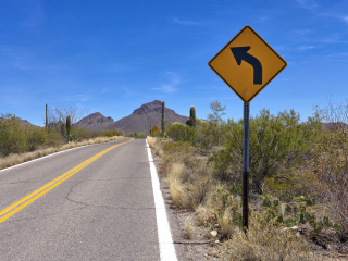 Looking E along McCain Loop Rd. toward Gates Pass. Mark is to the right.