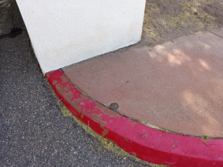 Eyelevel view of the disk in the sidewalk