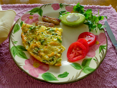 Southwest Frittata with sausage, tomatoes, avocado and cilantro