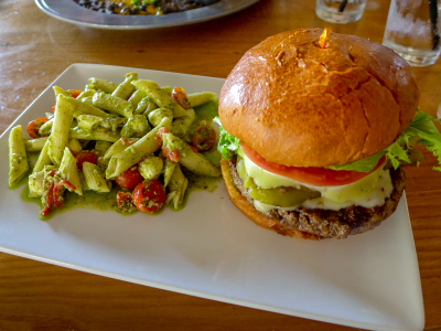 Southwest (green chile) cheeseburger and pesto pasta salad at Four Peaks