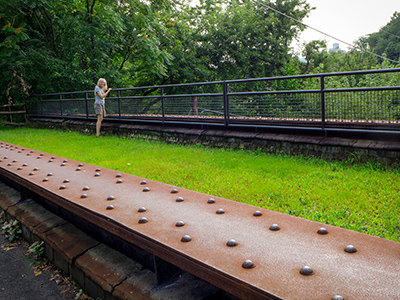 Zhanna checking out the scenery from an old railroad overpass.