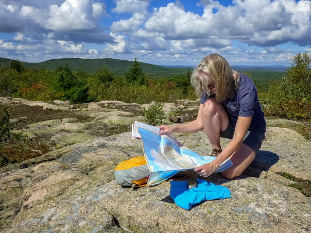Studying the map before looking for the next abandoned trail!