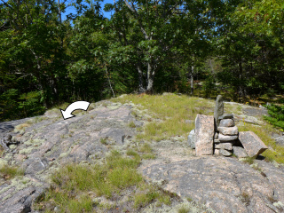 Mark (indicated) is close to the summit cairn.