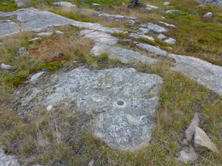 Eyelevel view of the disk on the ledge.