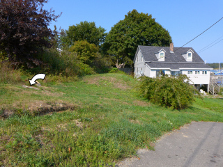 Looking NE from the edge of the wharf parking area, mark indicated