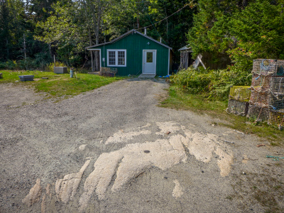 Looking W toward a building on the property