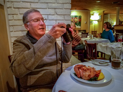 Rich takes a photo of his chicken dinner for Dad