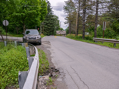 Looking NE along Sandy Banks Road. USGS BM should be in the field ahead on the right.