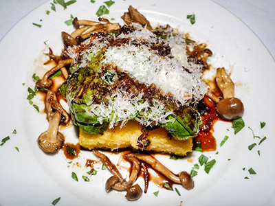 Crispy Polenta with sautéed greens, shiitake and crimini mushrooms, balsamic reduction and parmigiano reggiano