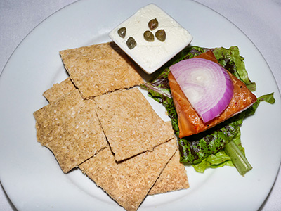 Applewood Smoked Salmon with goat and cream cheese caper spread, red onion, house-made sesame wheat crackers