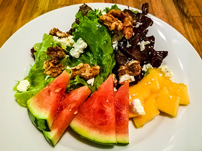 Local melon salad with spiced walnuts and feta