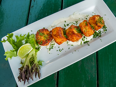 Panko-Breaded Crab and Lobster Cakes with green onion sauce and lime