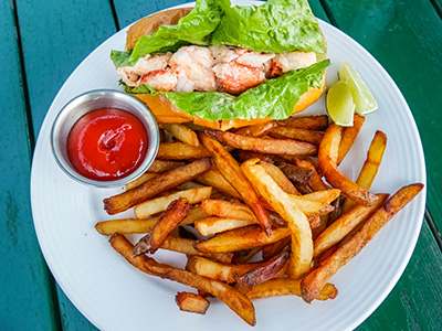 Lobster Roll on a toasted brioche bun, served with French fries