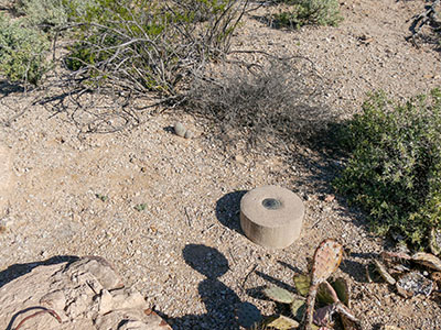 Eyelevel view of the disk on the round concrete monument