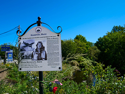 The monument is near this historical marker