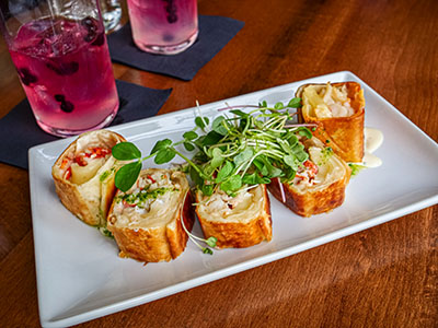 'French Lobster Roll' with lobster, brie, and caramelized onions rolled in griddle-crisped tortilla