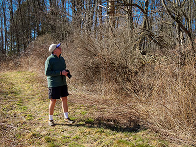 Rich wonders what is on the other side of the rock wall.