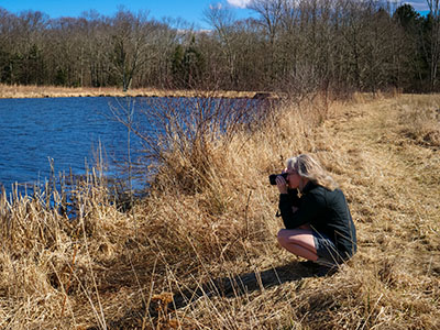 Zhanna looks for an interesting angle on the pond