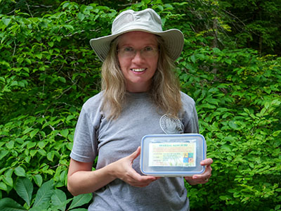 Zhanna with the geocache.