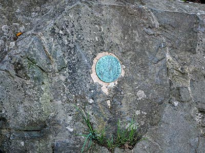 Eyelevel view of the disk set vertically on the outcrop