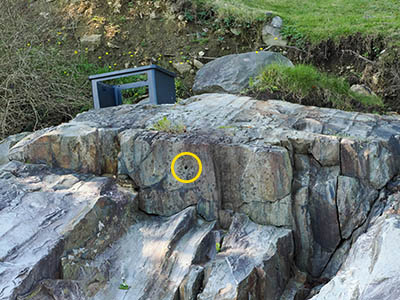 Drill hole (indicated) on the large rock outcrop that also holds TIDAL 7 STA 31 (PE0904)