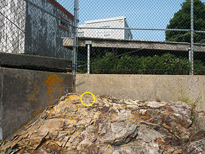 Looking NW toward the disk from the ledge that holds the lead-filled drill hole