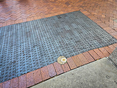 Eyelevel view of the disk in the sidewalk