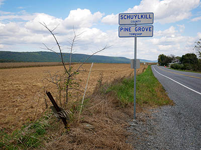 View NE, along PA Route 443; current county line sign visible