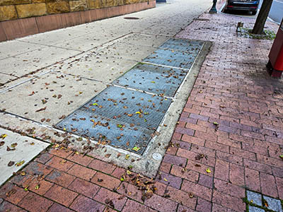 Eyelevel view of the disk in the sidewalk